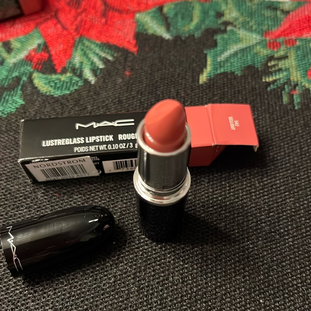 MAC Lip stick.  The color is Sell Out. More like a peachy Pink.  Beautiful!!